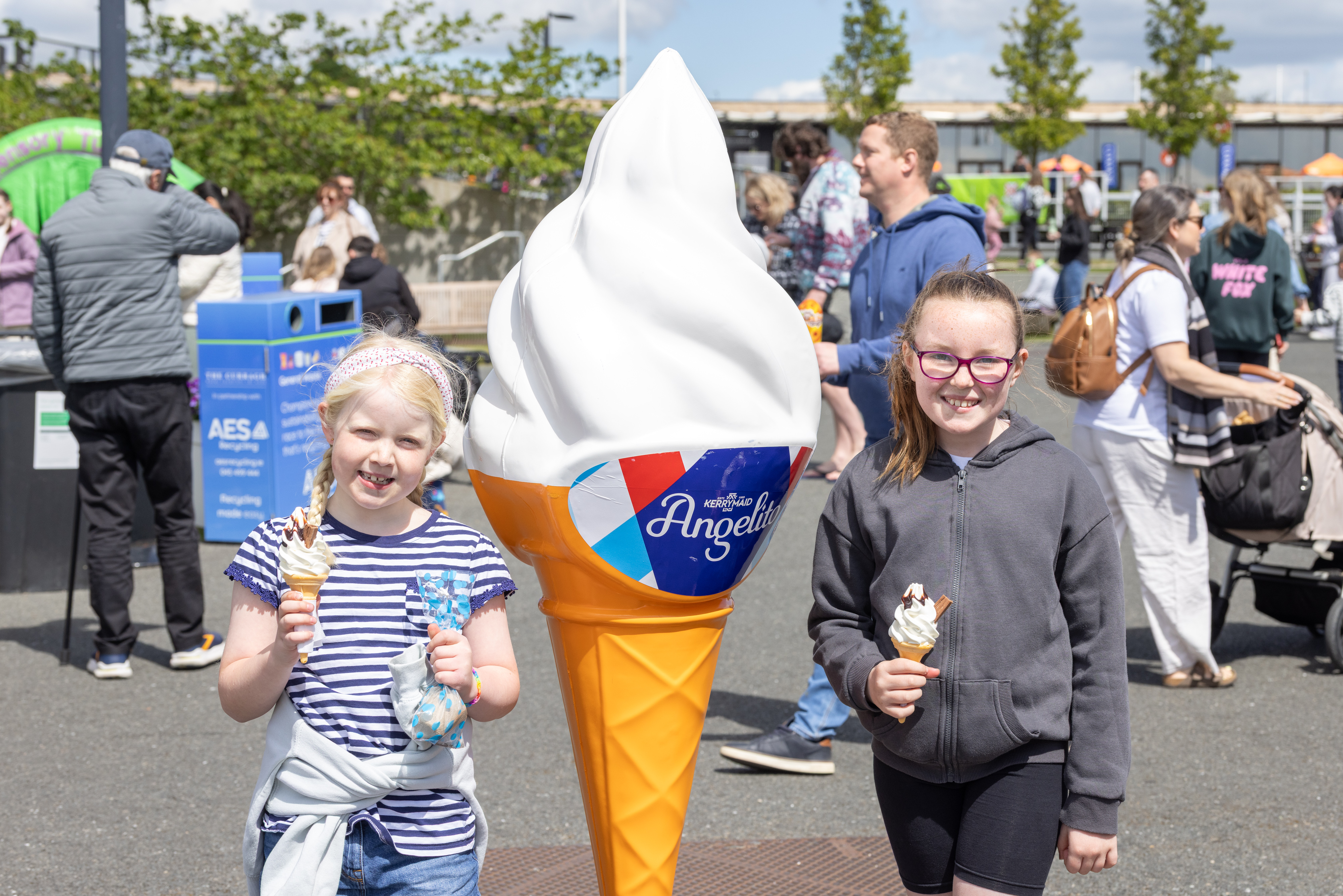 Two children smiling with ice-cream.